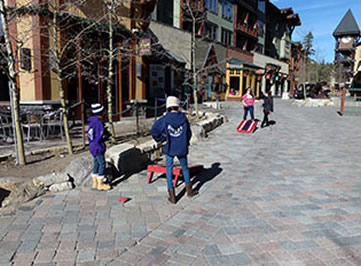 Playing bean bag at Mammoth Plaza