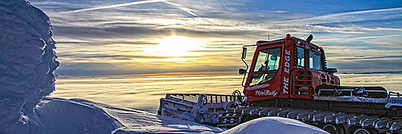 Sun Peaks BC sunset with groomer