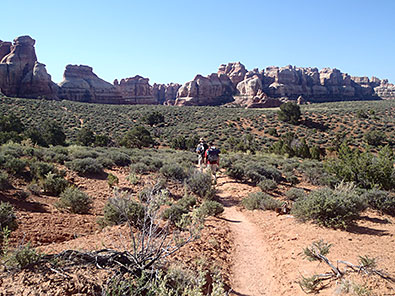 Hikers threading the Canyonlands Needle